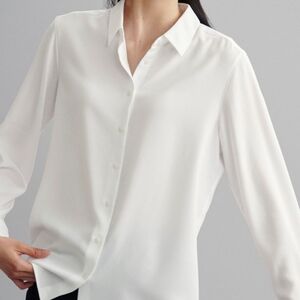 115. Uniqlo White Button-Up Shirt